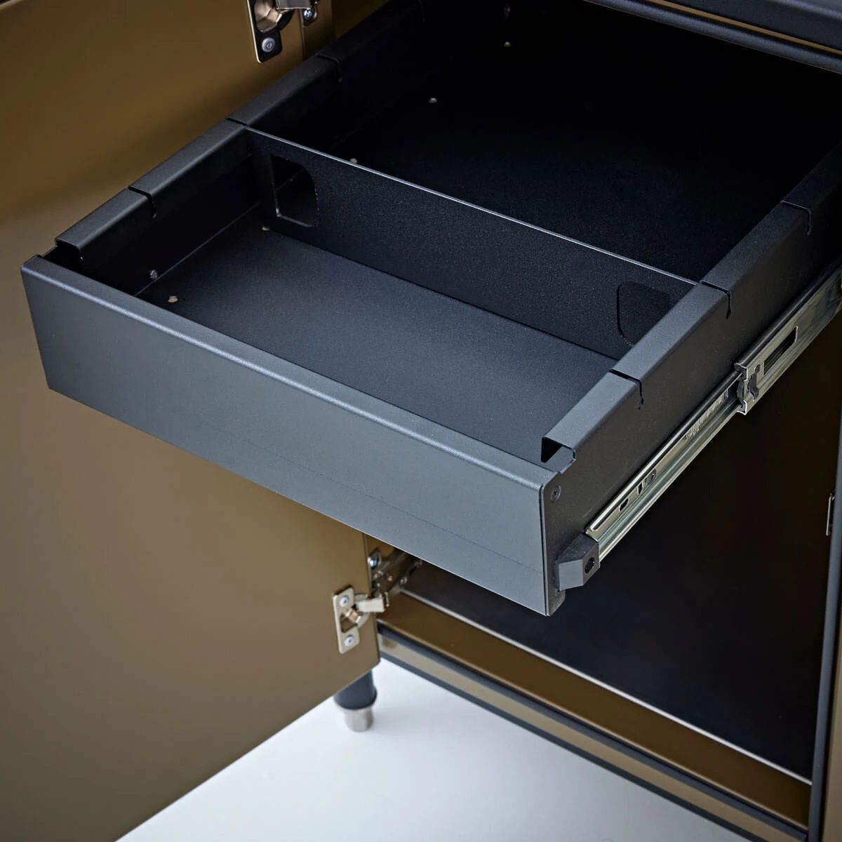 Custom outdoor kitchen drawer detail showing premium dark cabinetry and hardware. Shop outdoor kitchens near Spokane, WA.