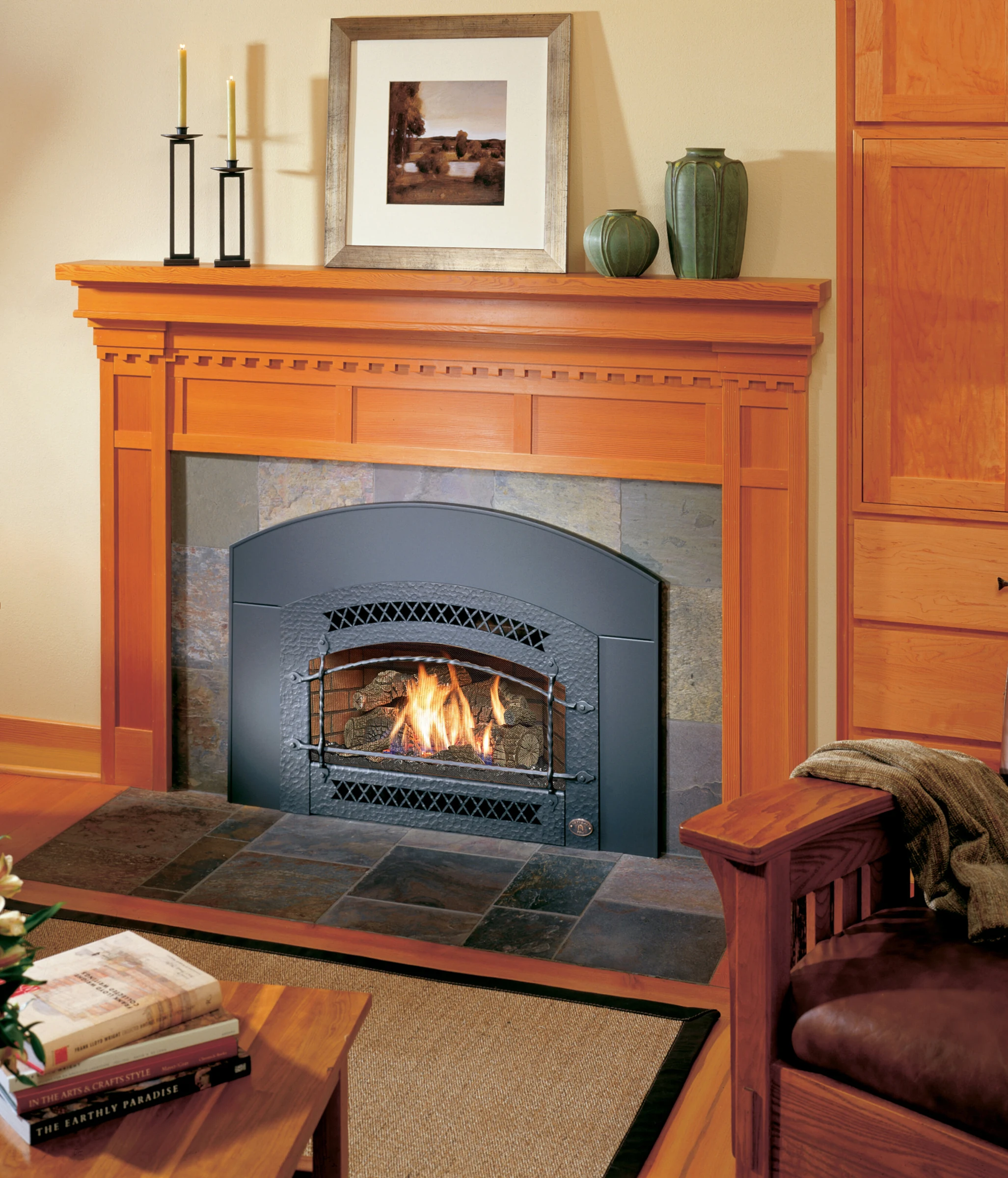 Fireplace Xtrordinair 32 DVS gas insert installed in a wood fireplace surround in a living room.