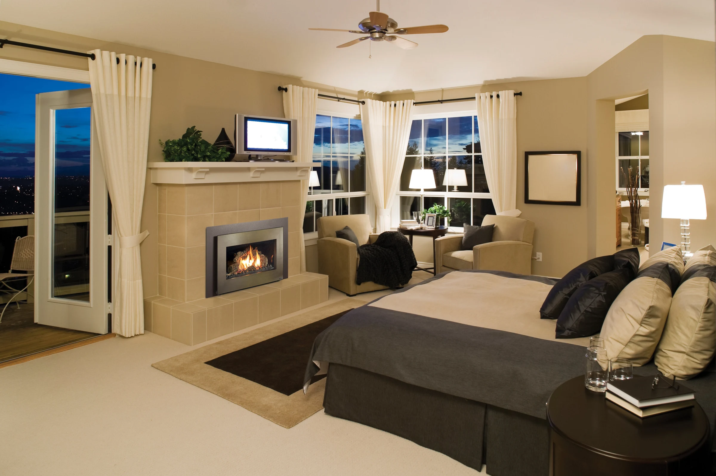 Fireplace Xtrordinair 32 DVS gas insert installed in a modern fireplace surround in a bedroom.