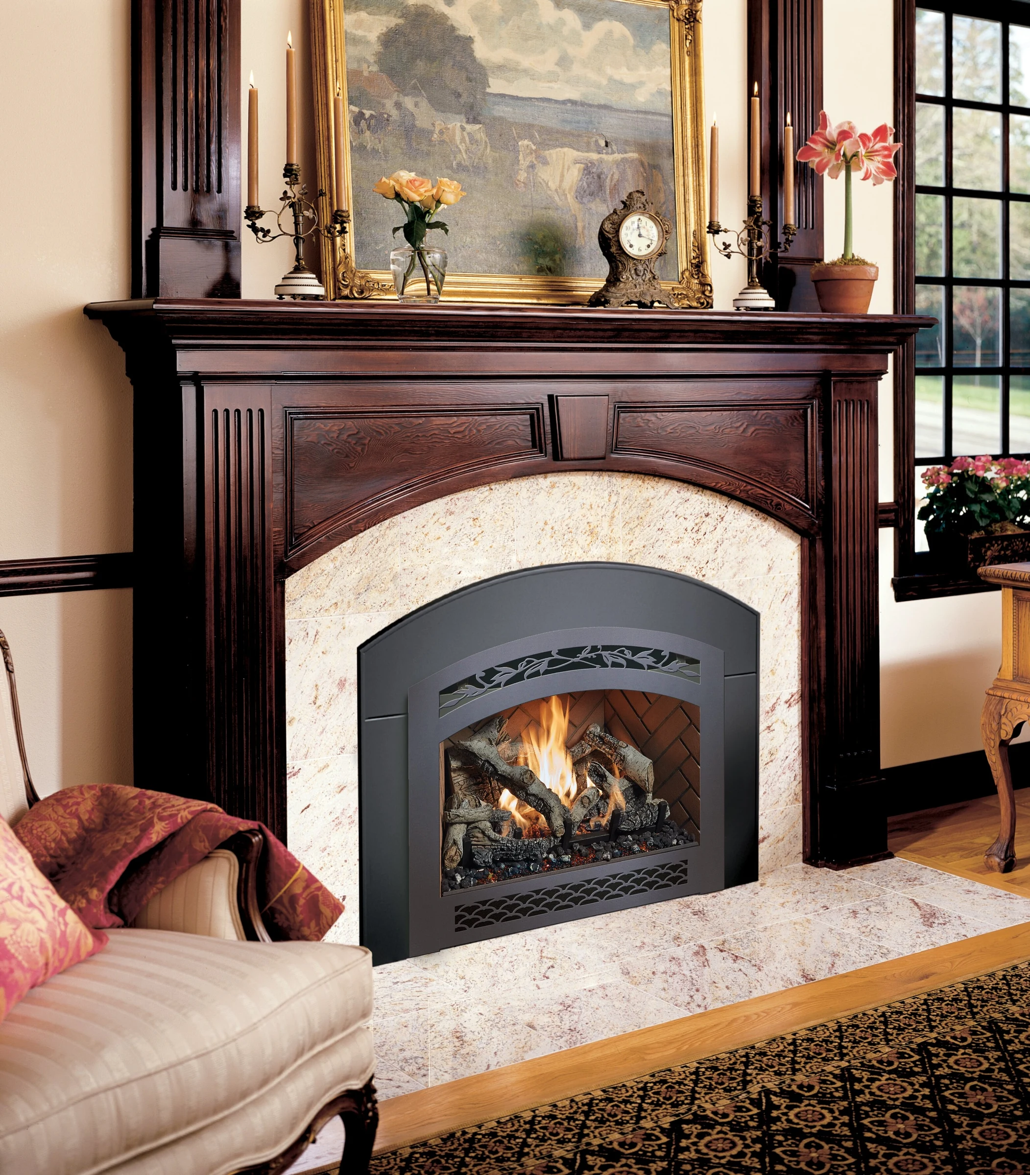 Fireplace Xtrordinair 34 DVL Deluxe Ember-Glo gas insert with arched face in a wood fireplace surround.
