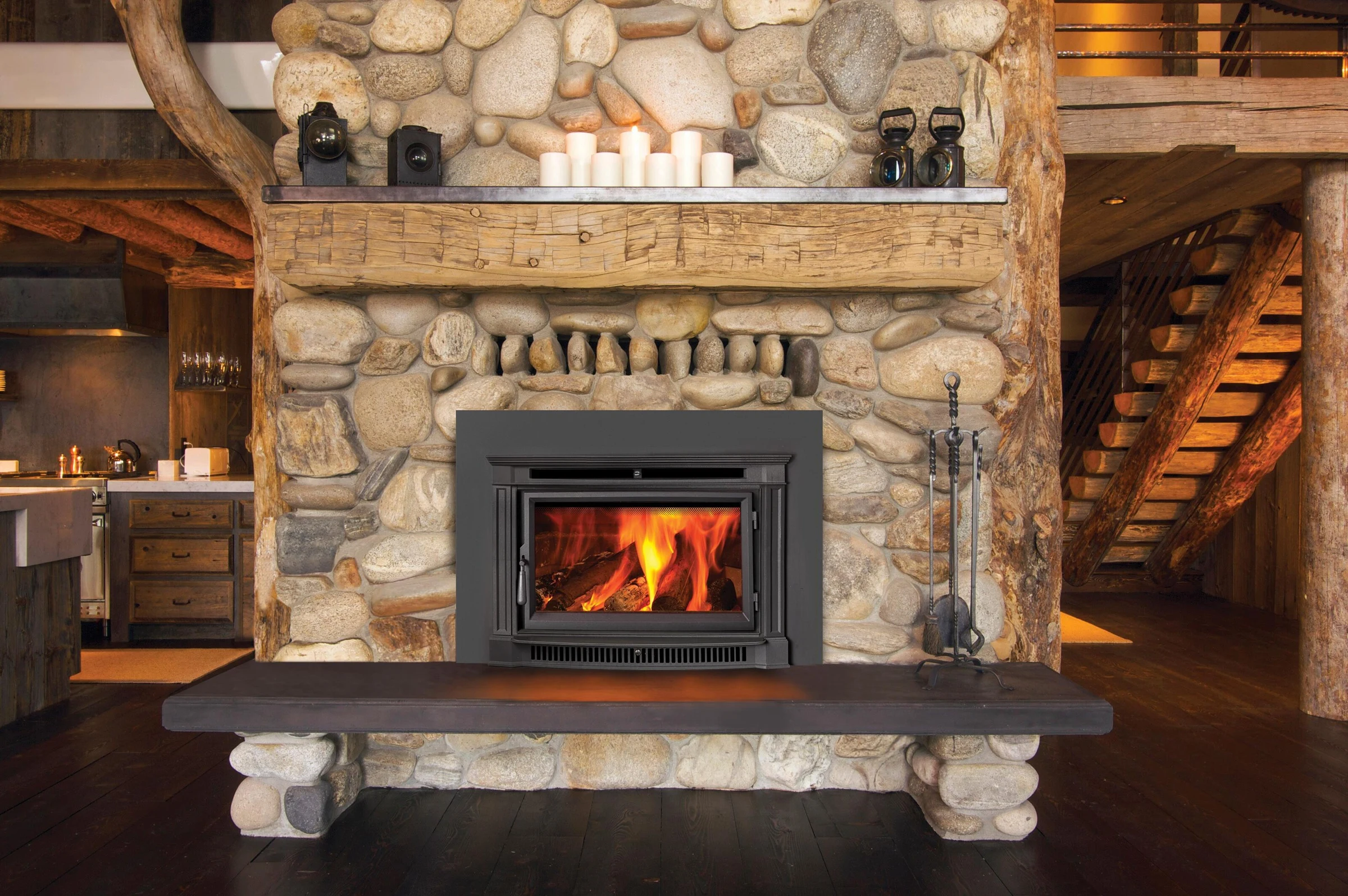 Fireplace Xtrordinair Large Flush NexGen-Hybrid wood insert installed in a stone fireplace surround with wood mantel.