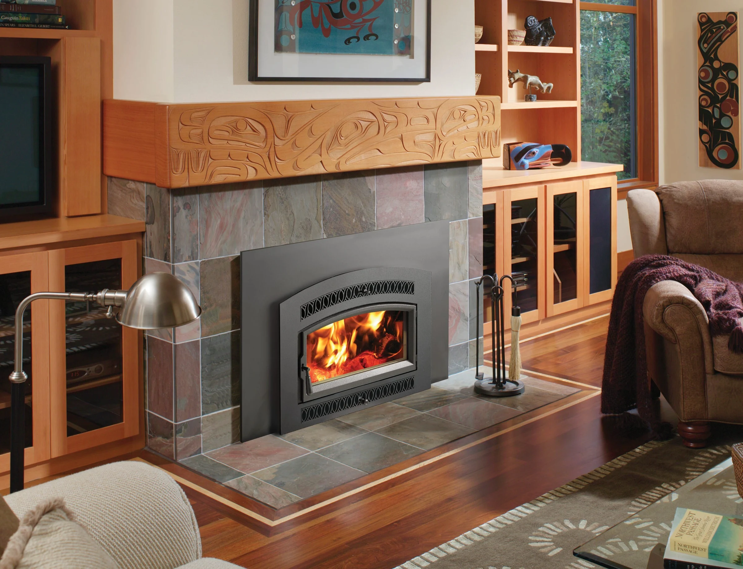 Fireplace Xtrordinair Medium Flush NexGen-Hybrid wood insert with arched face installed in a stone fireplace surround.