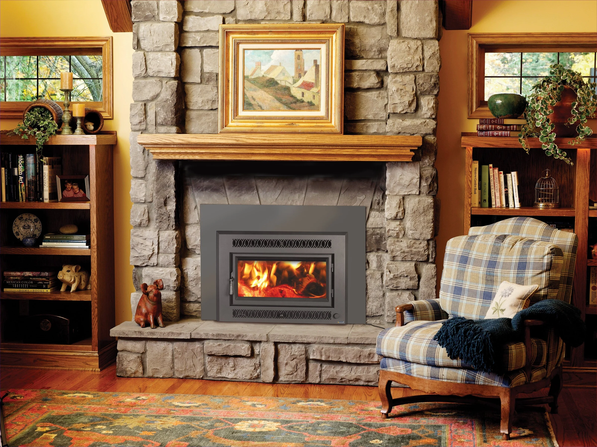Fireplace Xtrordinair Medium Flush NexGen-Hybrid wood insert with rectangular face installed in a stone fireplace surround.