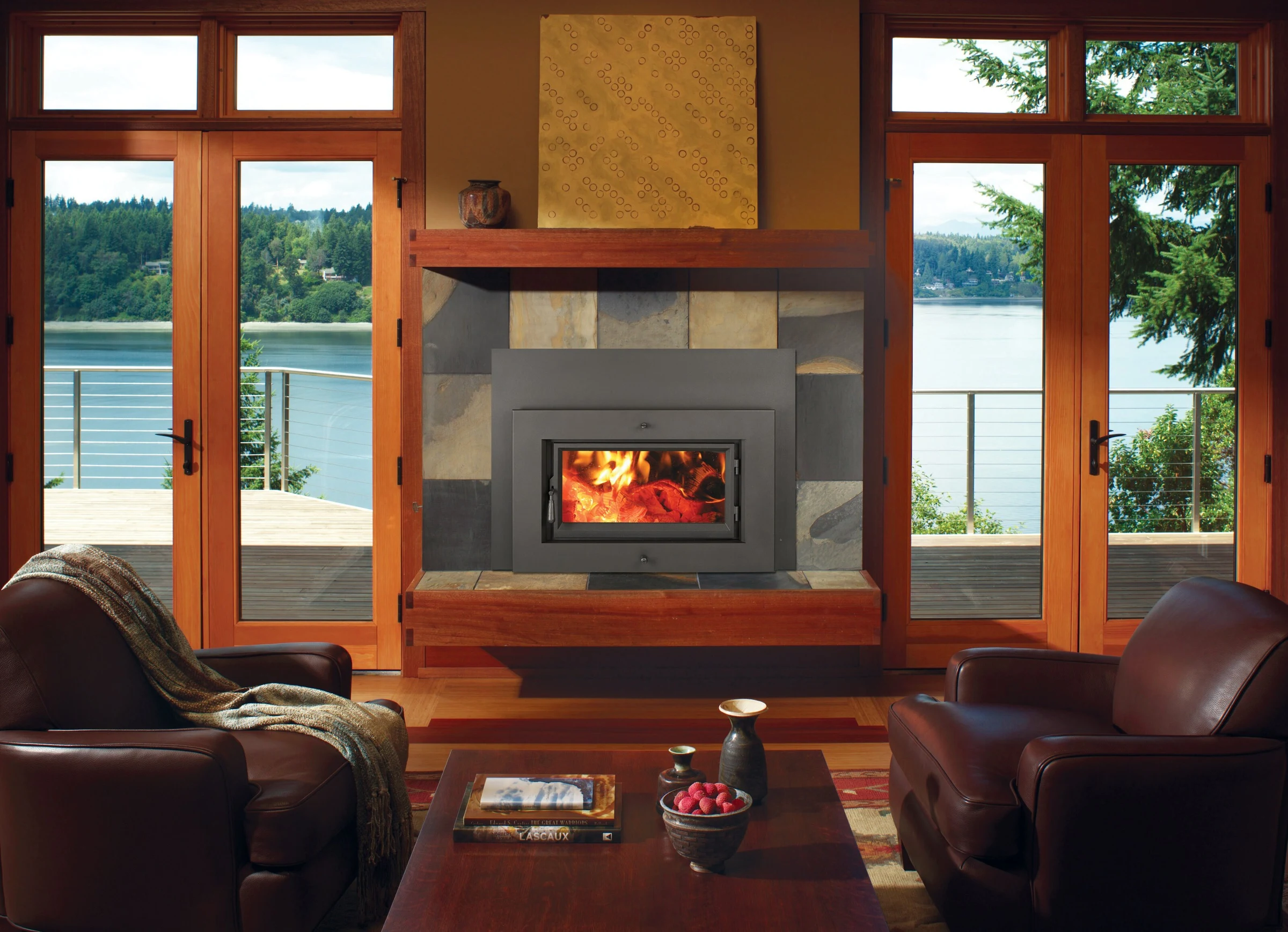 Fireplace Xtrordinair Medium Flush NexGen-Hybrid wood insert with rectangular face in a wood-paneled fireplace surround.