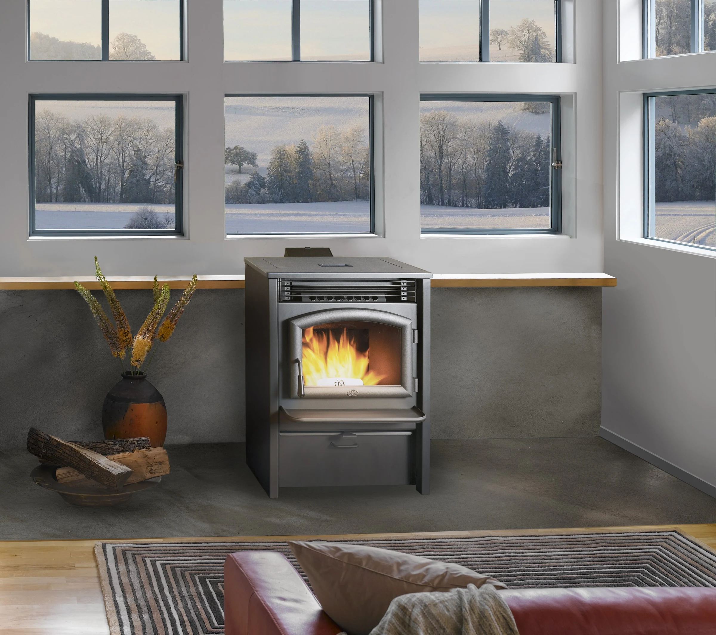 Lopi AGP Pellet Stove in a contemporary living space with light gray walls and framed artwork.