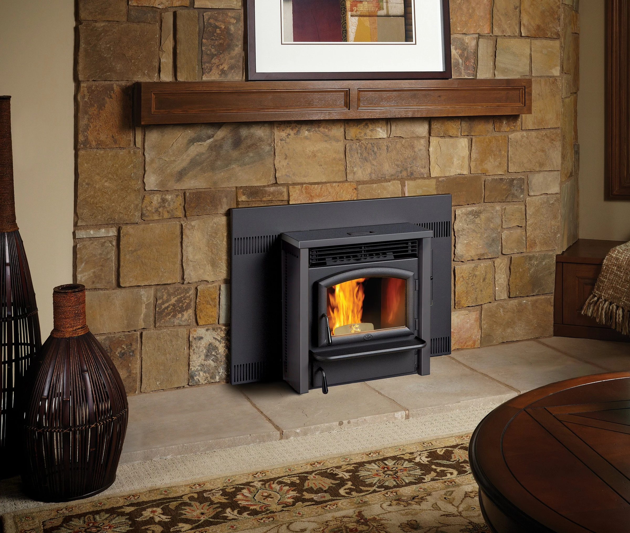 Lopi AGP pellet insert installed in a stone fireplace surround in a living room setting.