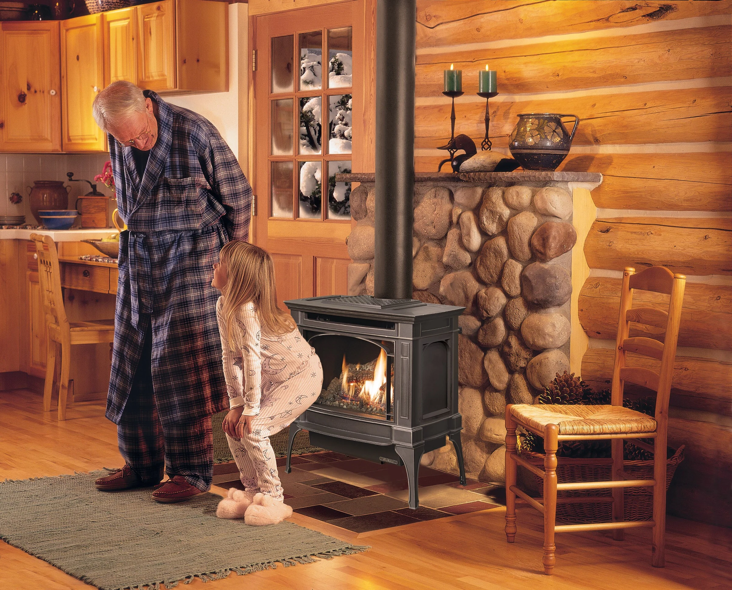 Lopi Berkshire Millivolt Gas Stove in a rustic log cabin living room with a stone accent wall and a person standing nearby.