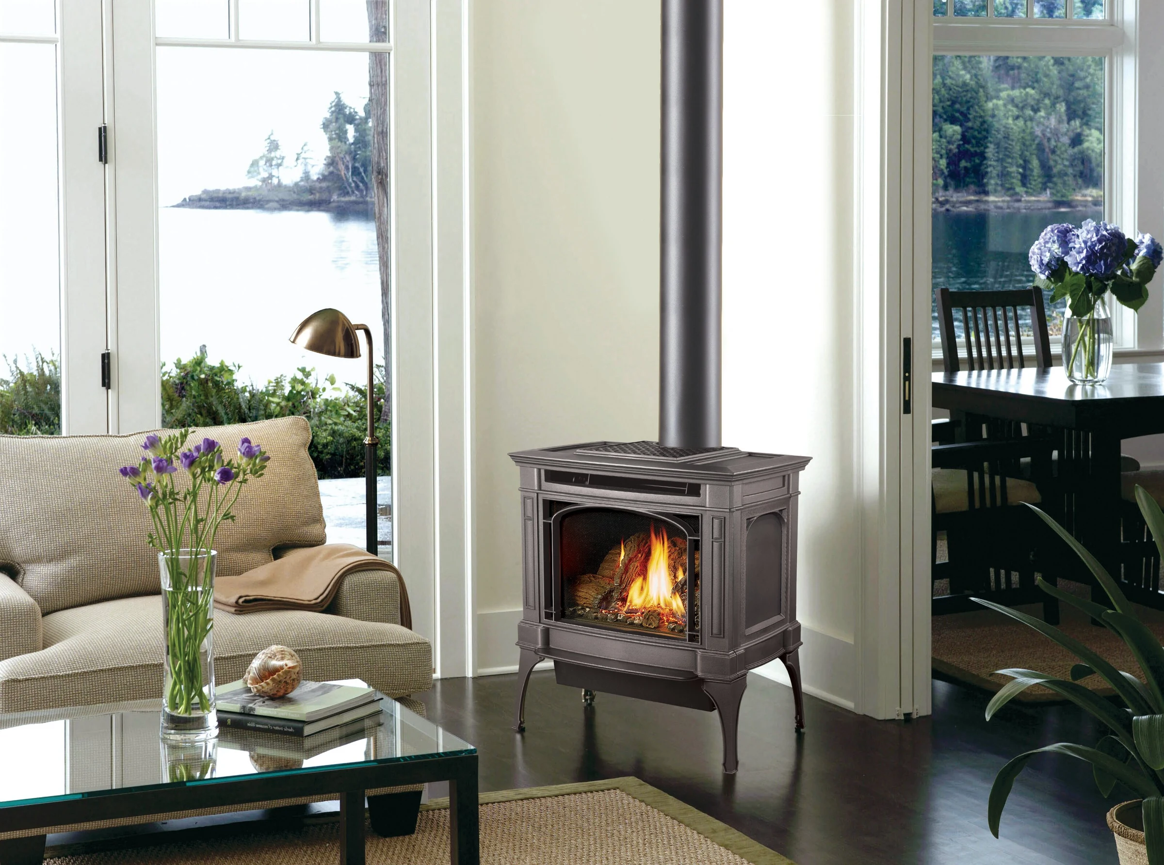 Lopi Berkshire Millivolt Gas Stove in a bright living room with neutral decor and a sofa visible in the background.