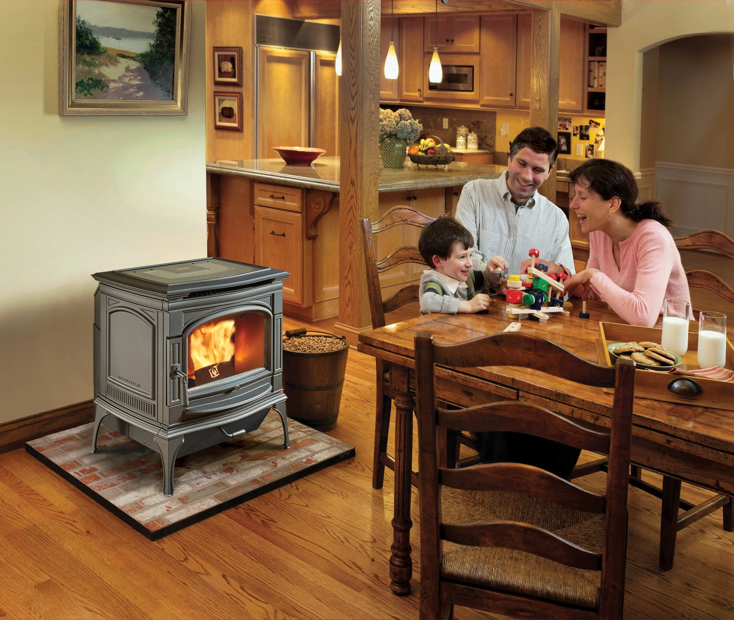 Lopi Deerfield Pellet Stove in a warm kitchen dining area with a family gathered around a table nearby.