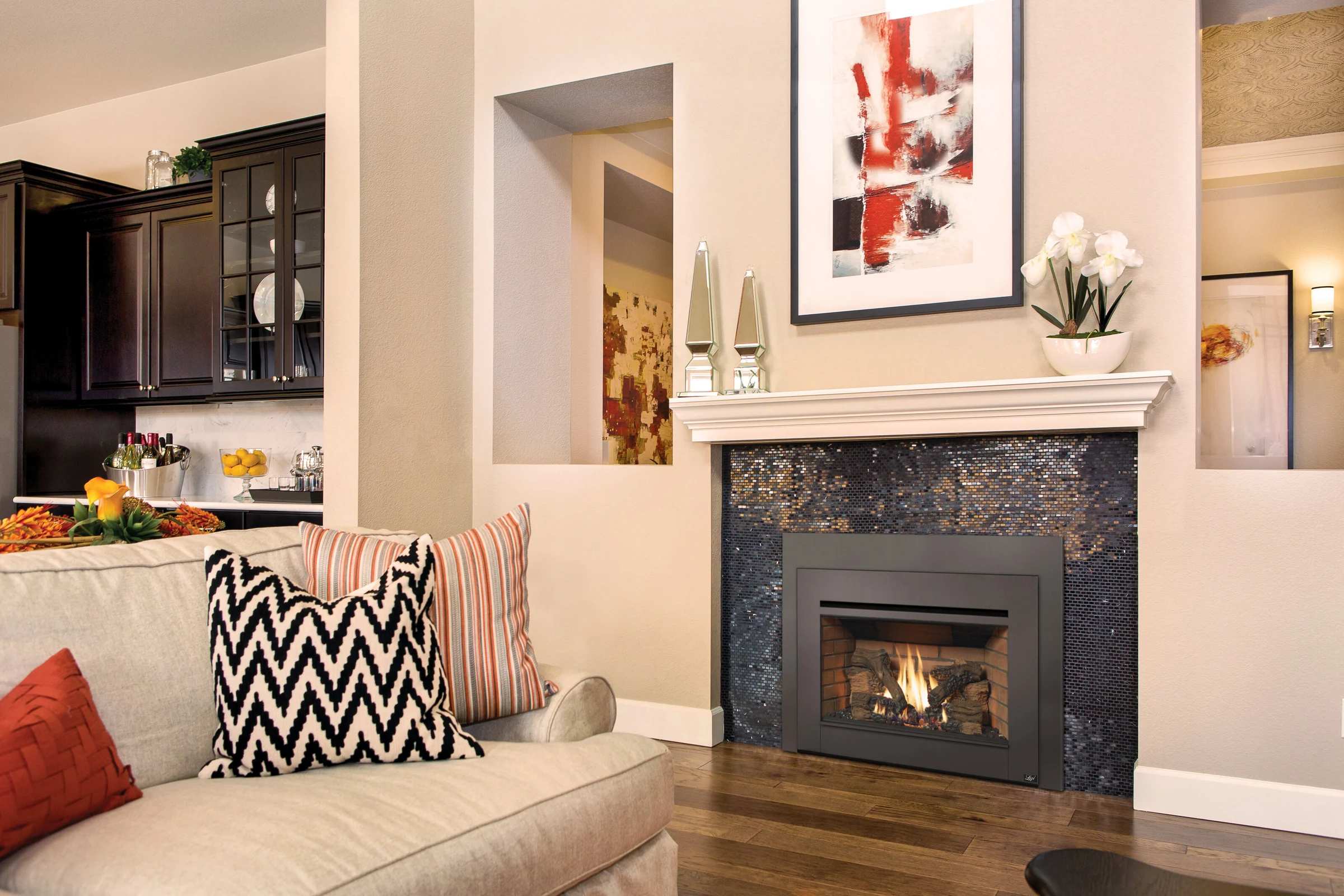 Lopi Radiant Plus large gas insert installed in a tile fireplace surround in a living room.