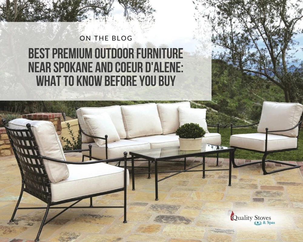 Premium outdoor patio furniture set with dark metal frames and white cushions on a stone patio near Coeur d'Alene and Spokane.