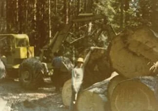 Jeff Barnhart skidding logs during his early logging days in Coeur d'Alene — where the inspiration for Quality Stoves & Spas first began