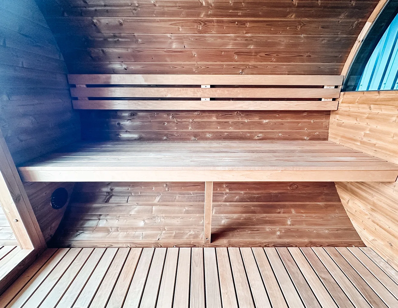 Thermory Ignite Barrel Sauna interior with deep thermo-aspen benches